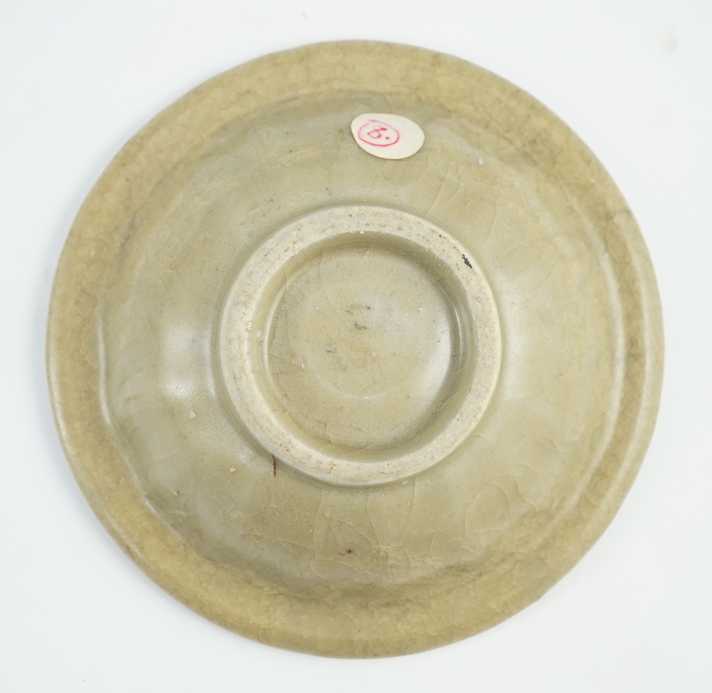 A small Chinese Longquan ‘golden’ celadon ‘twin-fish’ marriage dish, Southern Song-Yuan dynasty, 12cm diameter